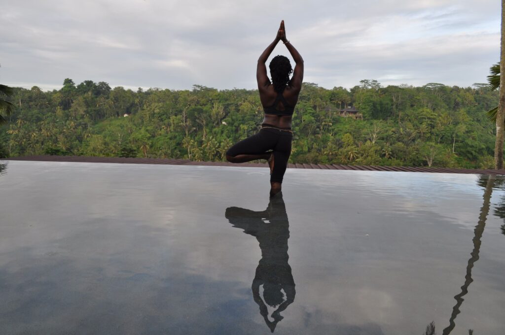 Personalized Mindful Yoga And Meditation Practice Janet Haughton Quarshie In A Tree Pose In Kupu Kupu