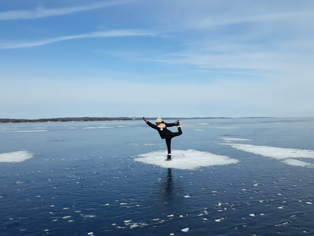 A person is doing yoga on the ice